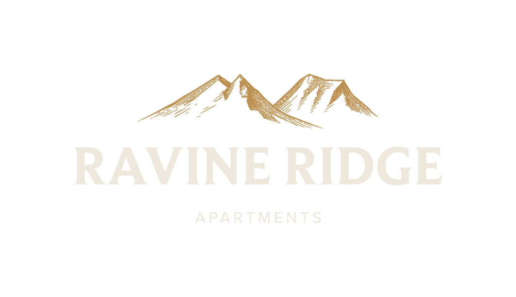A logo for Ravine Ridge Apartments featuring a mountain range.